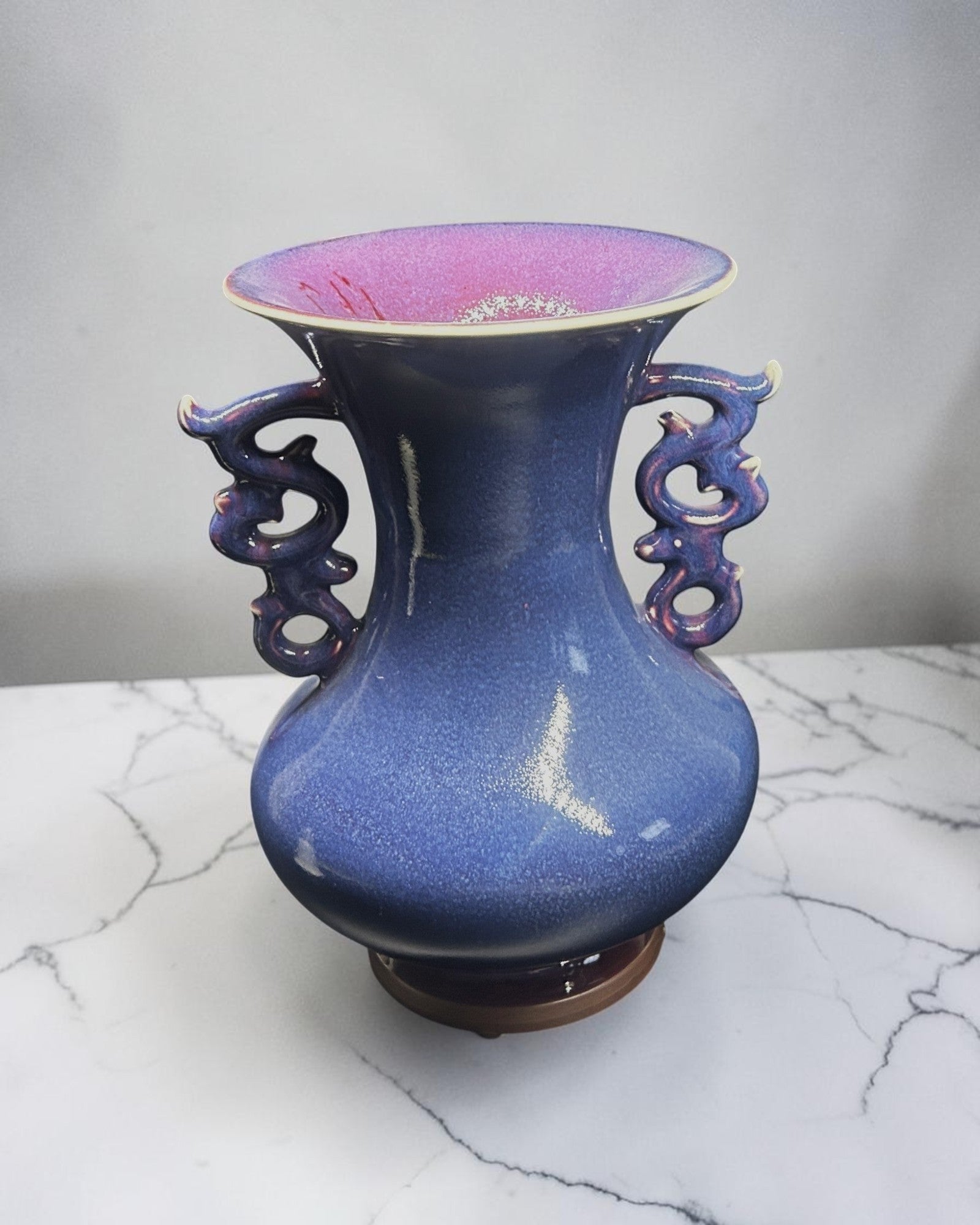 C&C Atelier deep blue speckled ceramic vase with flared rim and dragon-shaped handles, perfect for decor.