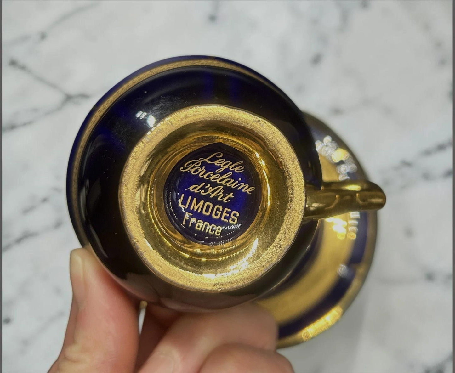 C&C Atelier Gilded Porcelain Teacup and Saucer, cobalt blue with gold interior and detailing, French Limoges porcelain.